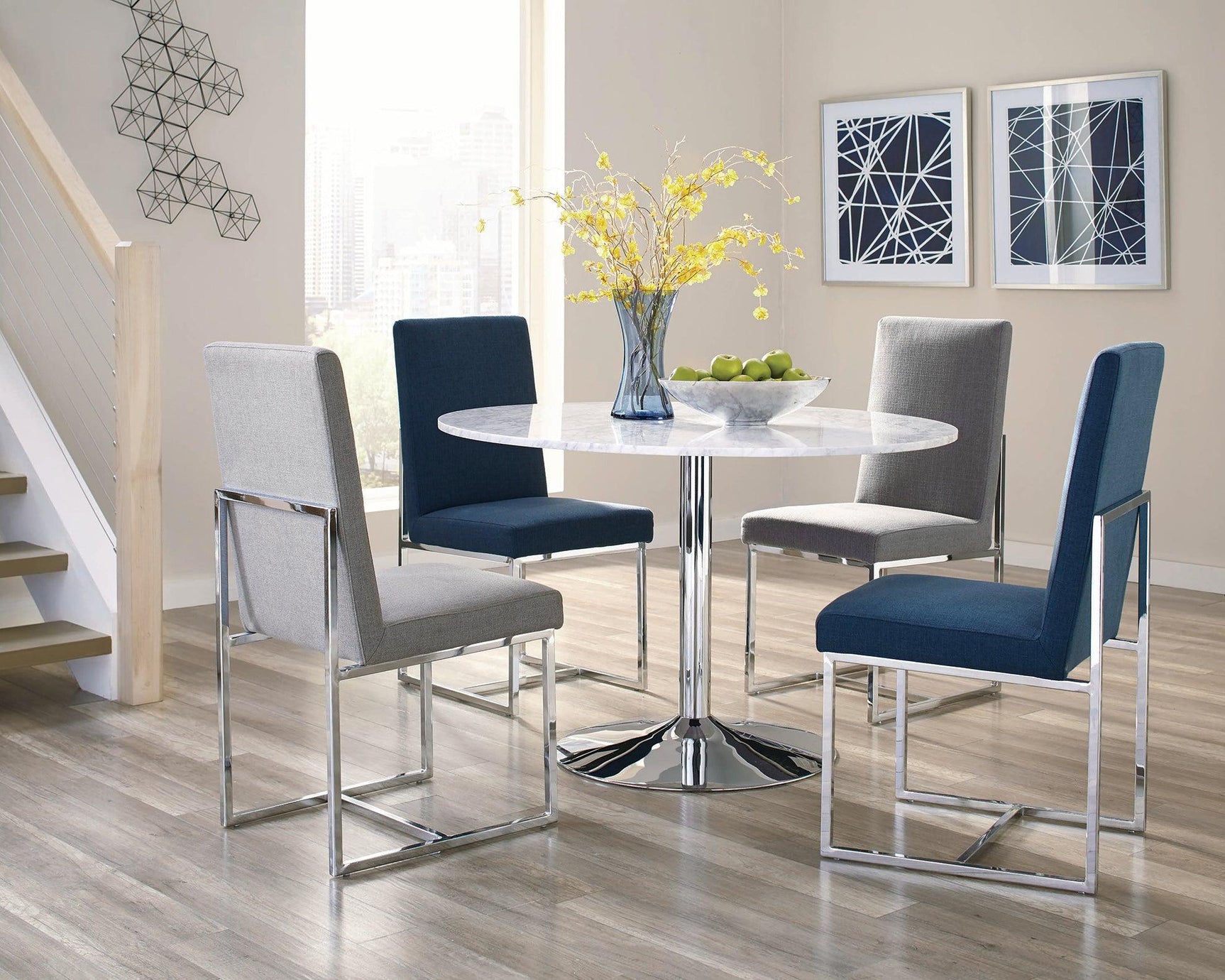 Close-up of chrome metal legs and plastic glides on Mackinnon chair