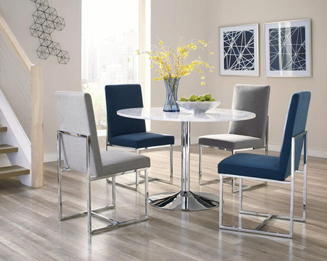 Close-up of chrome metal legs and plastic glides on Mackinnon chair