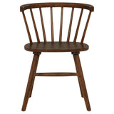 Close-up of chair's spindle back and curved crest rail