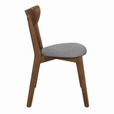 Side angle showing walnut wood frame and upholstery of Alfredo dining chair