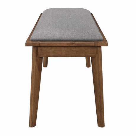Close-up of grey upholstered seat on Alfredo Dining Bench