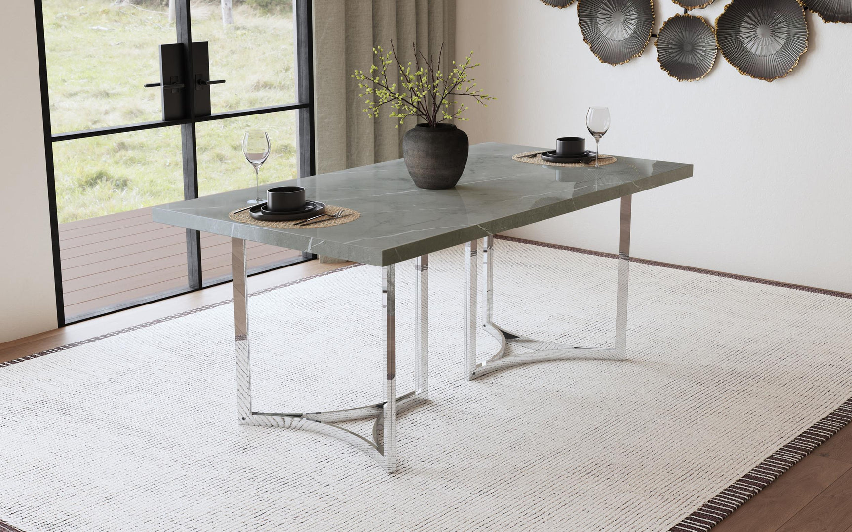 Polished chrome steel base of Sterling dining table detailed view