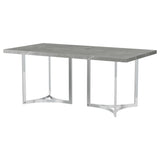 Dining table setup with plates and chairs around Sterling 72-inch table