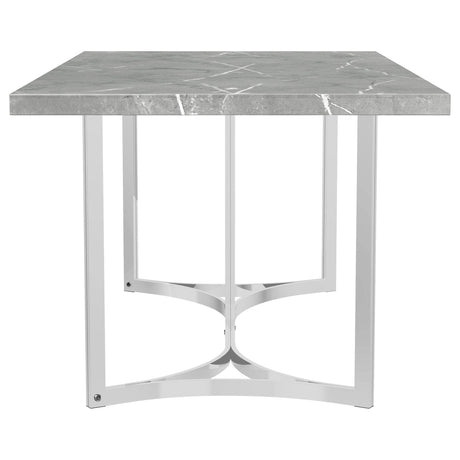 Angle showing steel base with chrome finish on Sterling dining table