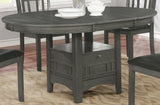 Room view of Lavon Oval Dining Set with four black leatherette chairs