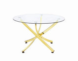 Beckham round dining table close-up of brass finish metal frame and glass top