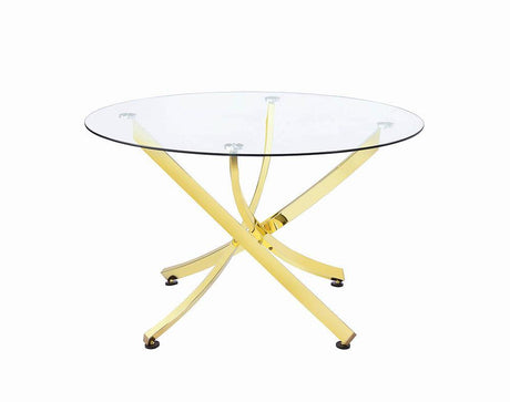 Beckham round dining table close-up of brass finish metal frame and glass top
