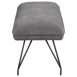 Bench seat corner showing fabric and cushion layers