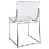 Side view of chrome round glass top table with 4 chairs