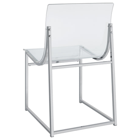 Side view of chrome round glass top table with 4 chairs