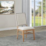 Side profile of Middleton dining side chair with black nailhead trim