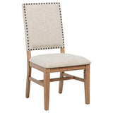 Close-up of beige fabric upholstery and nailhead detail on Middleton chair