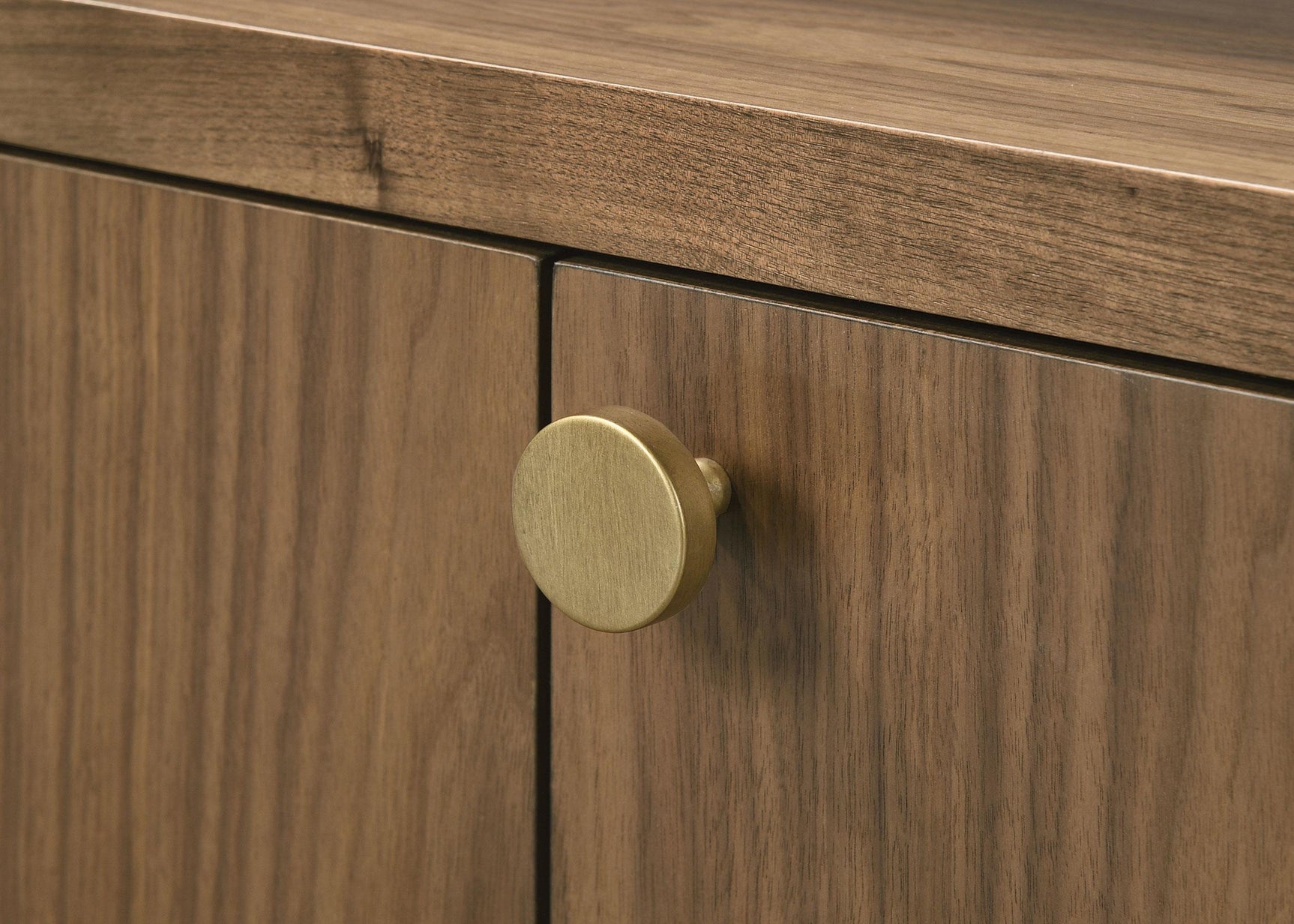 Sideboard doors partially open revealing storage