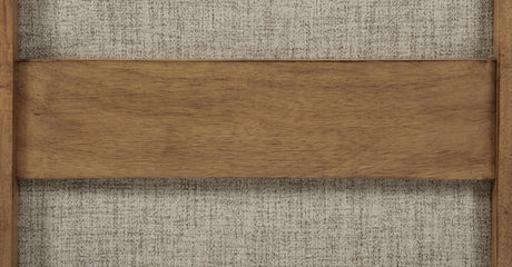 Brown fabric upholstered chair in natural light