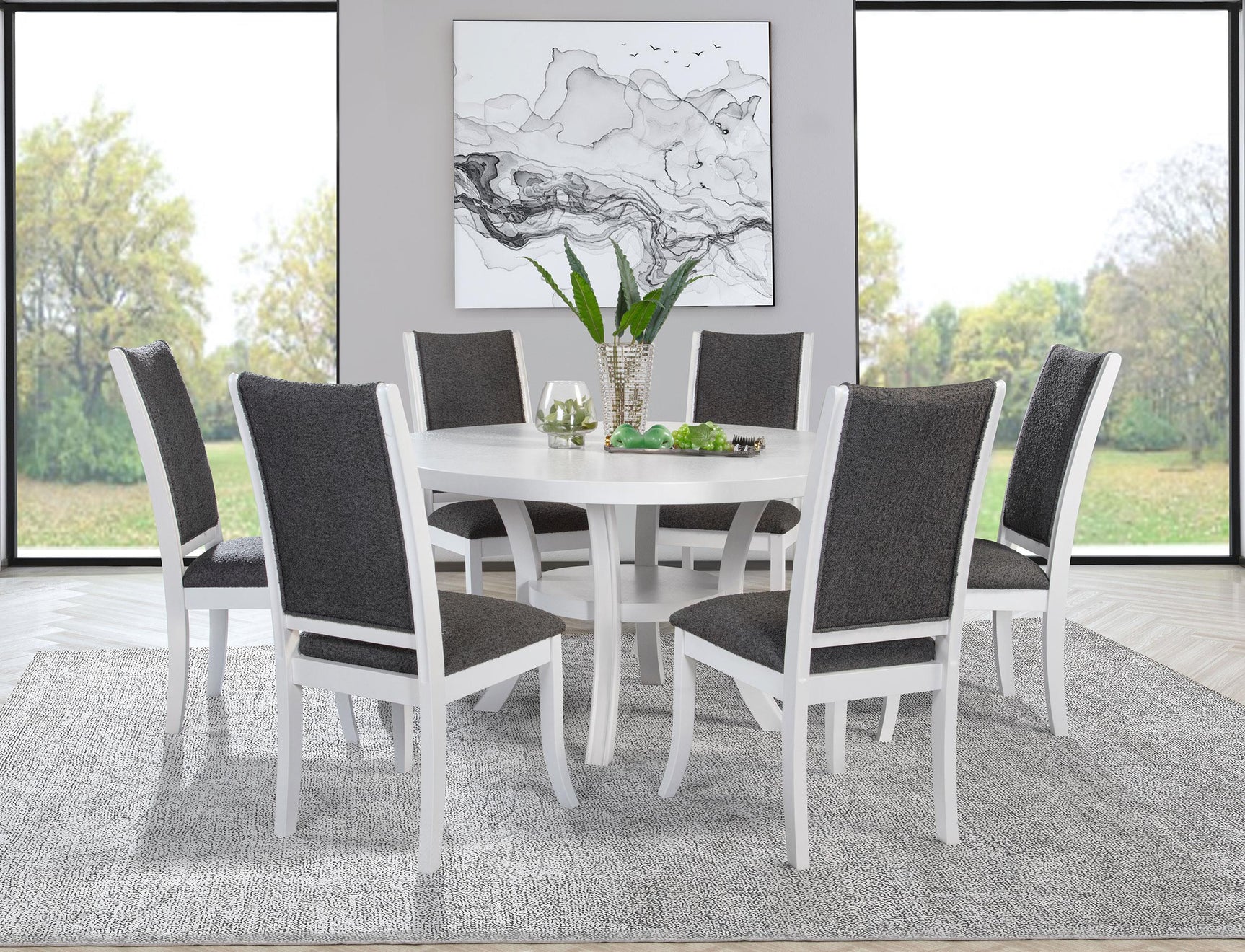 Judd round pearl white dining table with chairs in showroom setting