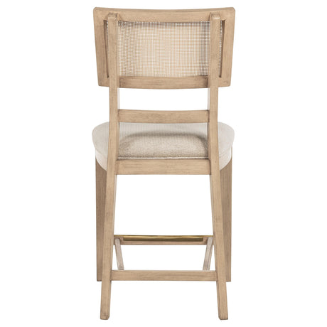 Close-up of chair leg and footrest area in beige oak