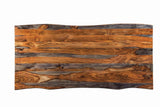Close-up of live edge detail on grey Sheesham wood dining table top