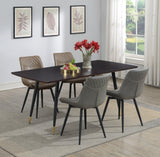 Brassie dining chairs in modern dining setup, grey upholstery