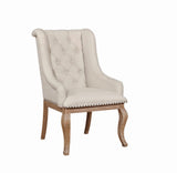 Side angle of Brockway Cove tufted arm chair showing rolled arms and upholstery