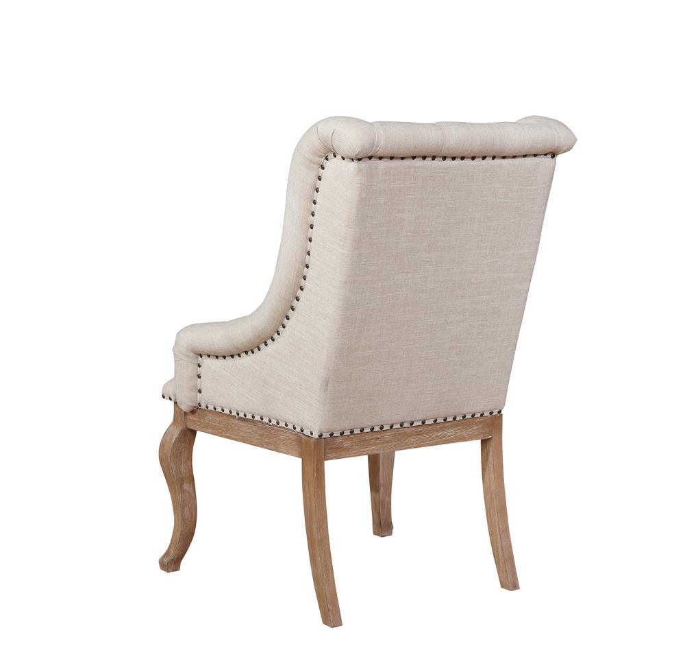 Pair of Brockway Cove cream upholstered arm chairs with barley brown frames in living space