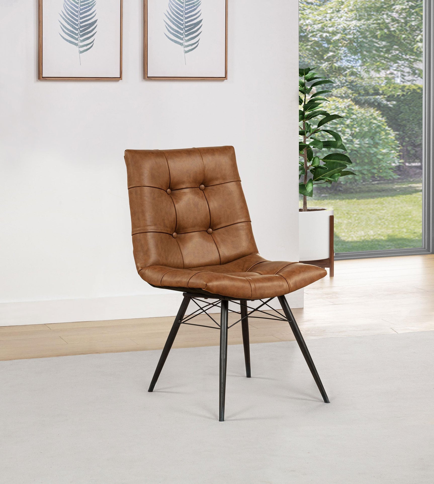 Aiken faux leather upholstered dining side chair showing button tufted back