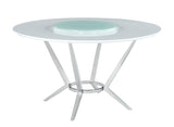 Room view of Abby circular dining table with lazy susan and four grey swivel chairs