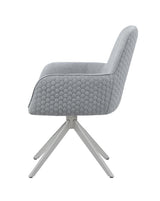 Close-up of honeycomb quilted light grey fabric upholstery