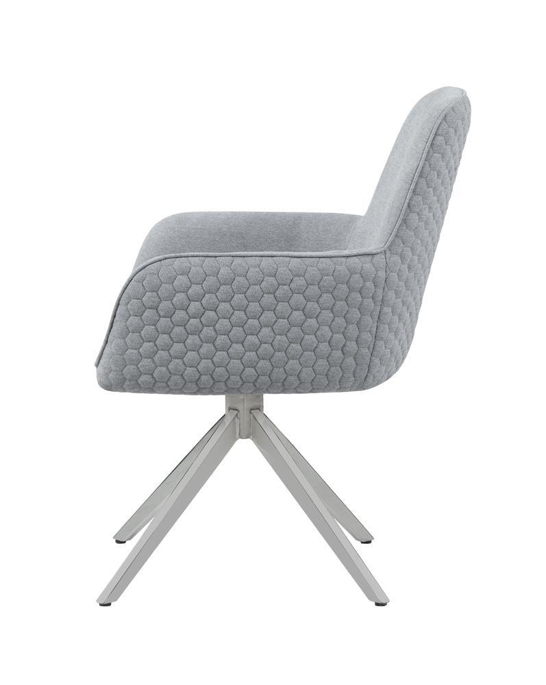Close-up of honeycomb quilted light grey fabric upholstery