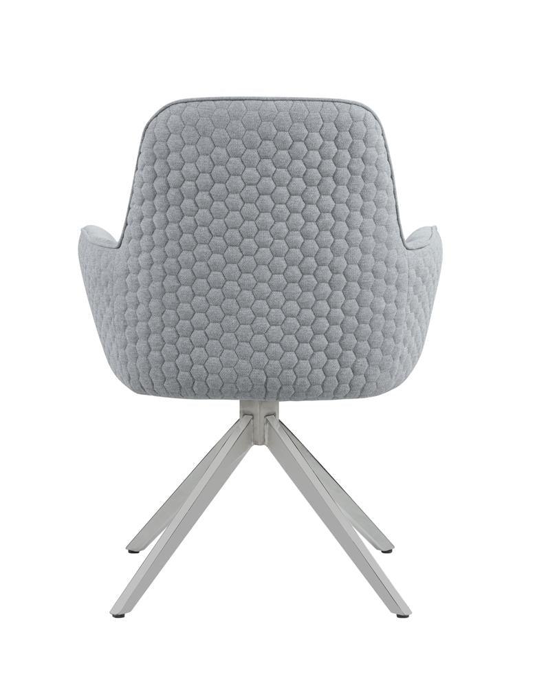 Detail of chrome swivel base and metal legs of Abby Dining Chair