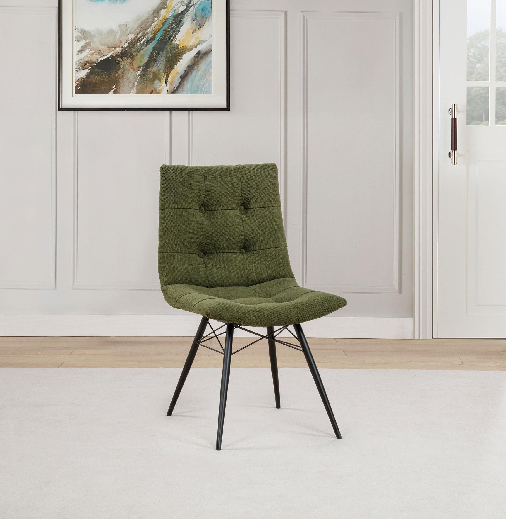 Side angle of Aiken upholstered dining side chair showing curved back and button tufting