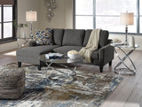 Hollynyx coffee table with decorative accents and sunglasses shown