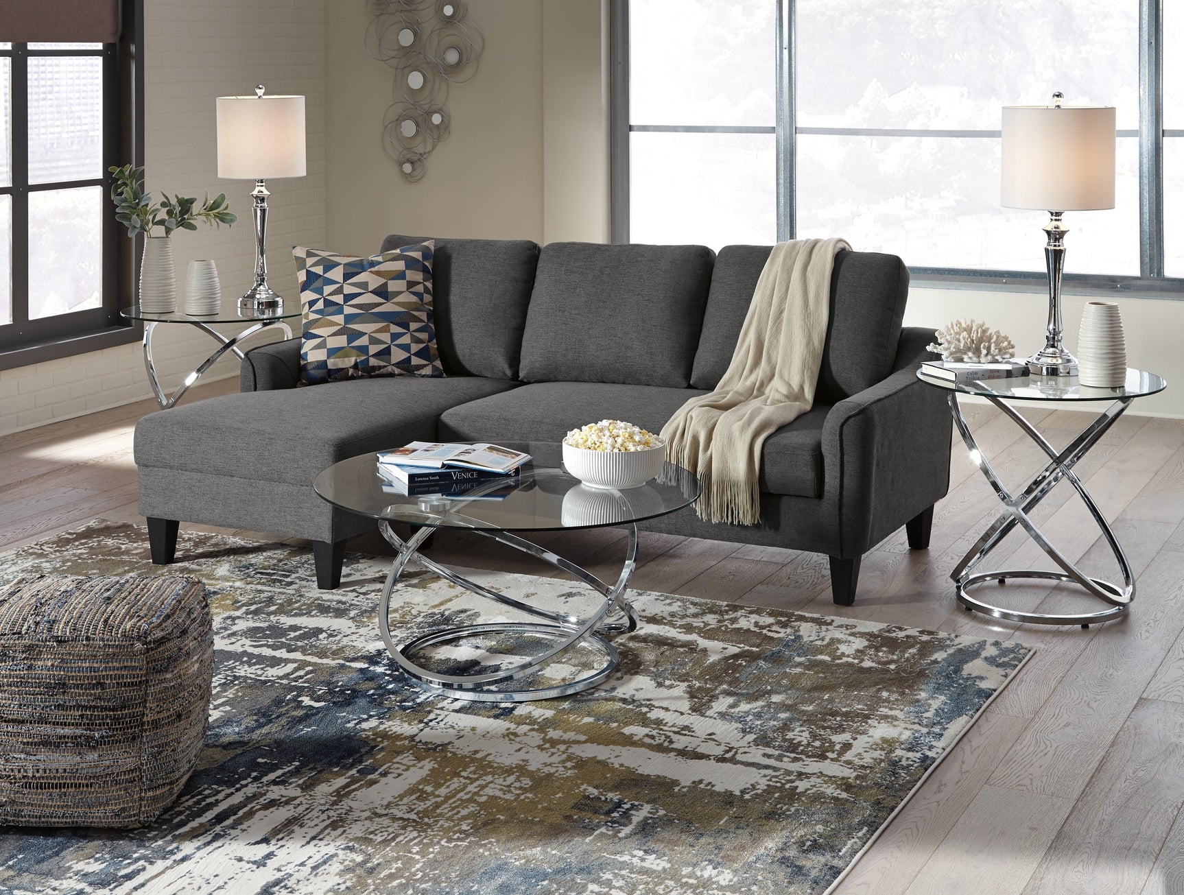Hollynyx coffee table with decorative accents and sunglasses shown