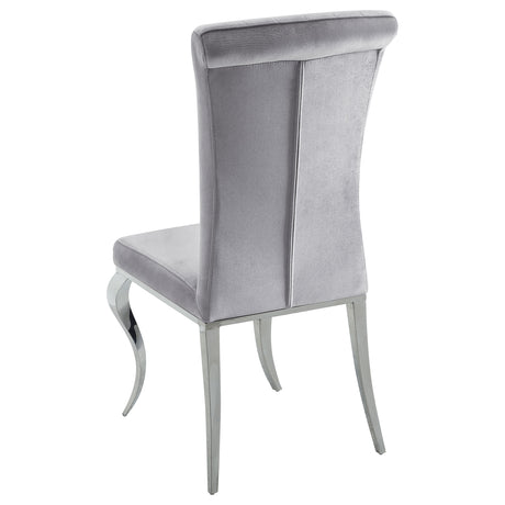 Detailed view of chair upholstery and table finish