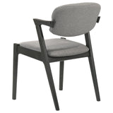 Back view of Stevie Upholstered Side Chair with flared black frame and padded backrest