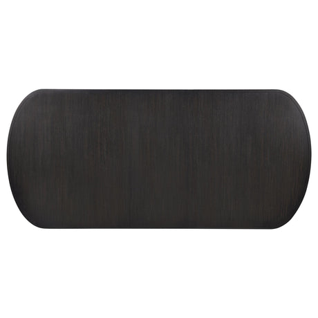 Burnished black pedestal base under the dining table