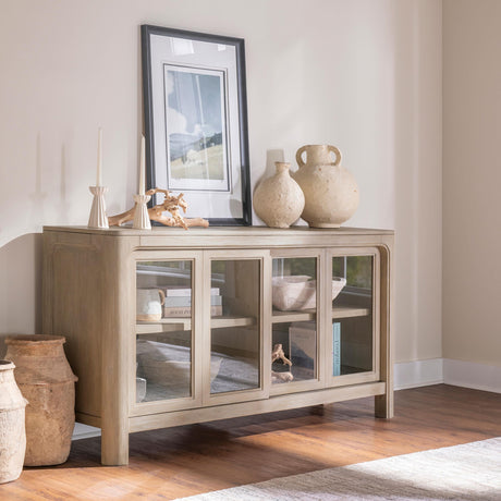 Sliding glass doors of Solano dining sideboard showing built-in shelving