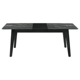 Room angle showing Crestmont black extension leaf table with chairs