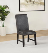 Side angle of Averill dark grey faux leather dining side chair