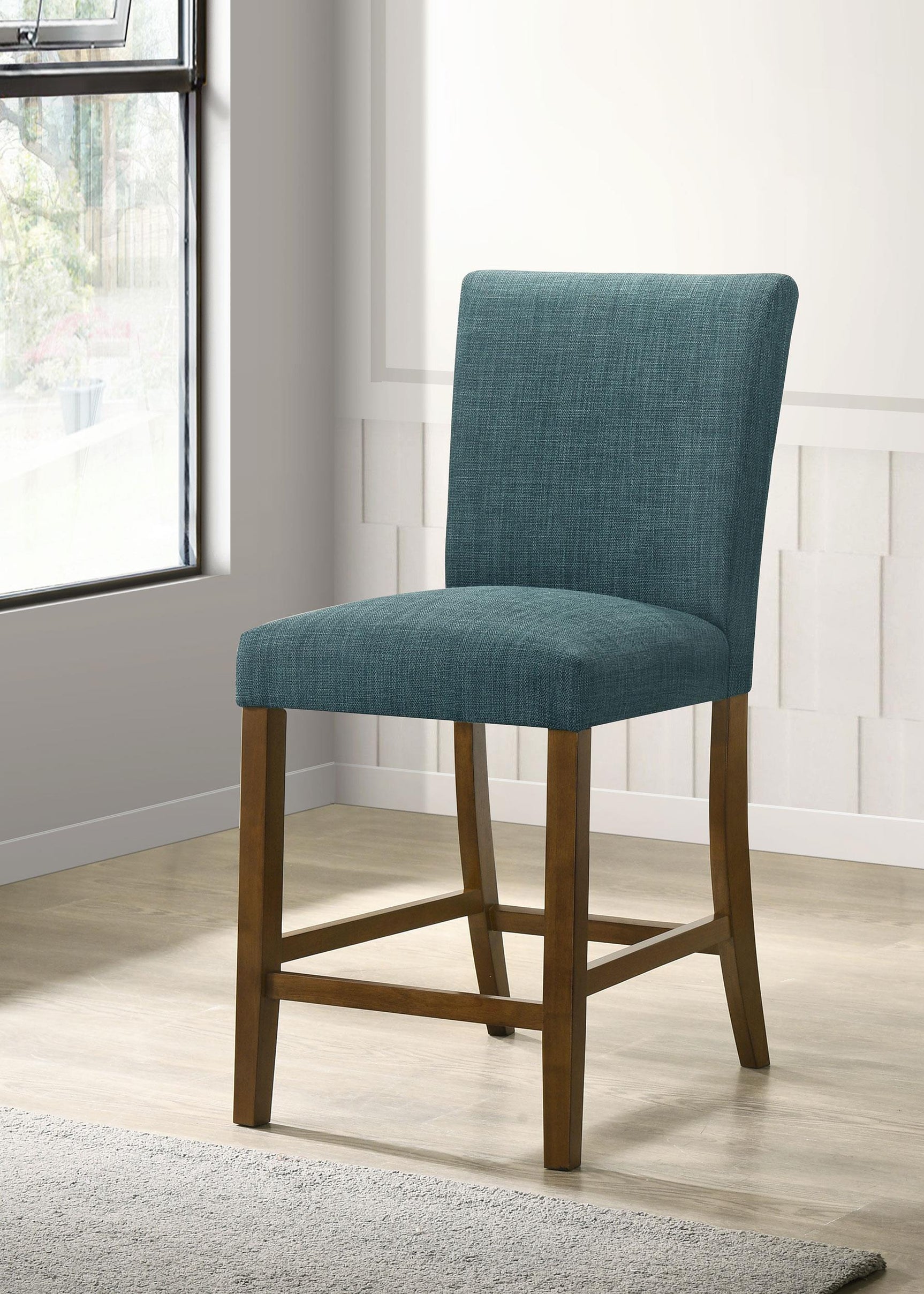 Paxton chair side angle showing teal upholstery