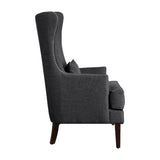 Avina Charcoal Fabric Wingback Accent Chair - closeup of nailhead trim and pillow