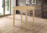 Round dining table set in room setting