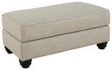 Asanti Fog Chenille Ottoman side angle displaying low profile and faux wood feet