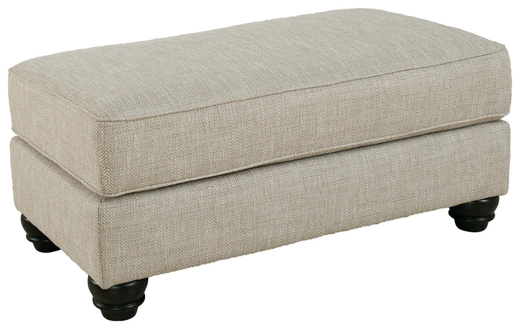 Asanti Fog Chenille Ottoman side angle displaying low profile and faux wood feet