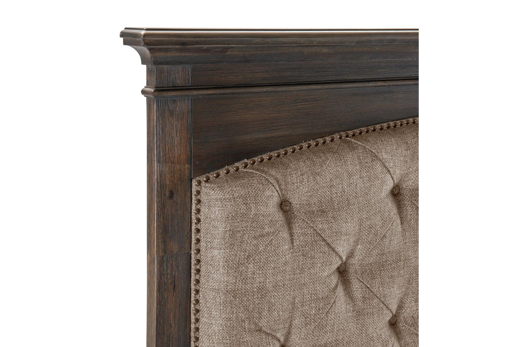 Close-up of tufted panel and nailhead details on bed