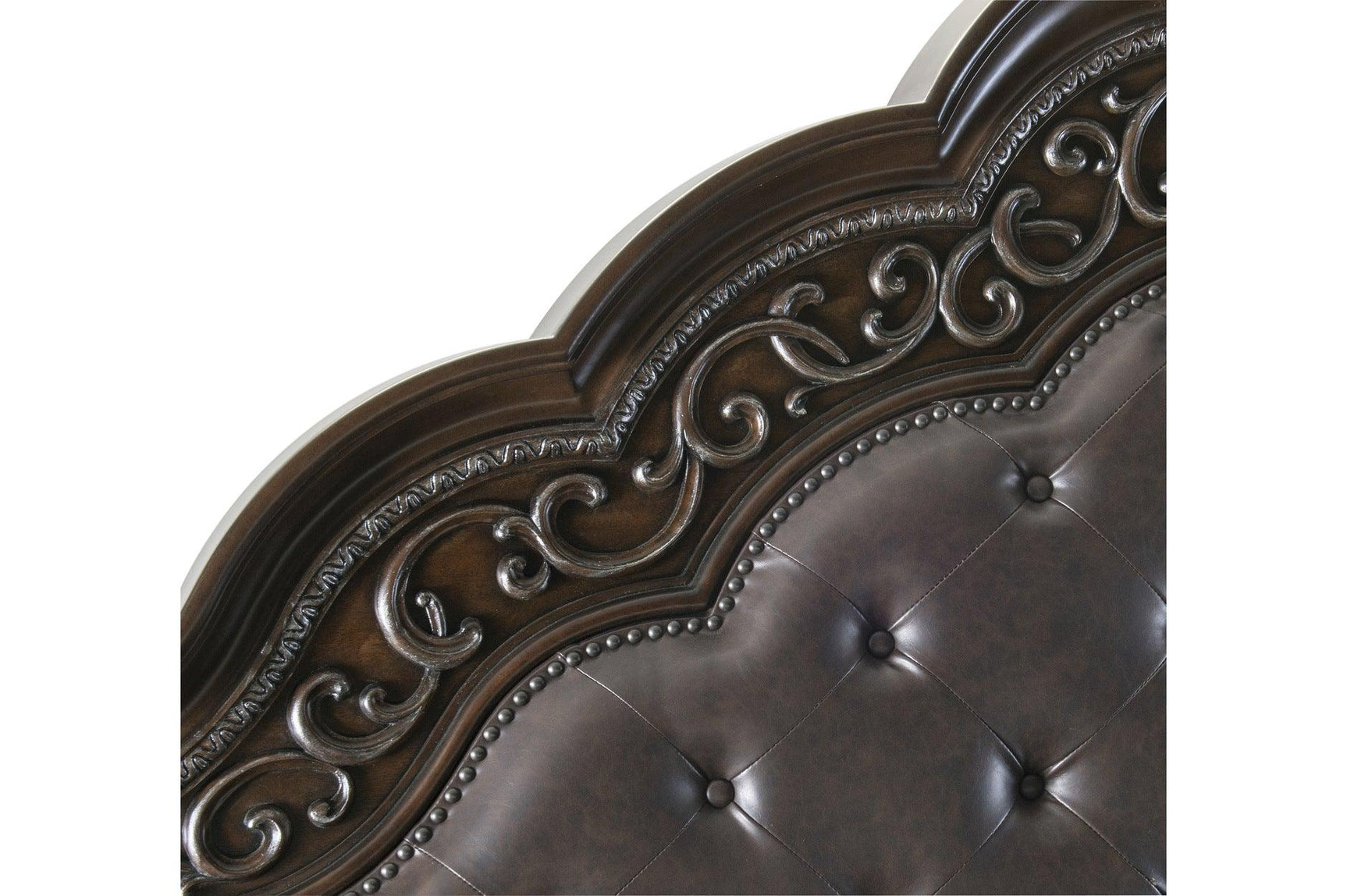Close-up front view of Beddington Bed headboard with tufted faux leather