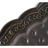 Close-up of tufted faux leather headboard with button details
