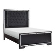 Aveline Black king bed angled view showing button-tufted faux leather headboard