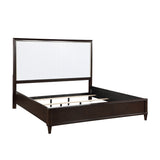 Side profile showing cherry footboard of Niles Queen Bed