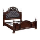 Details of scroll carving and finial accents on queen bed