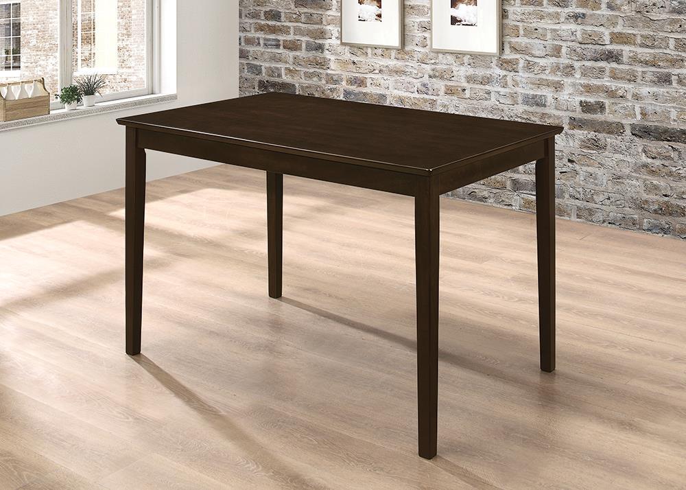 Room view of dining room set showcasing table, chairs, and bench